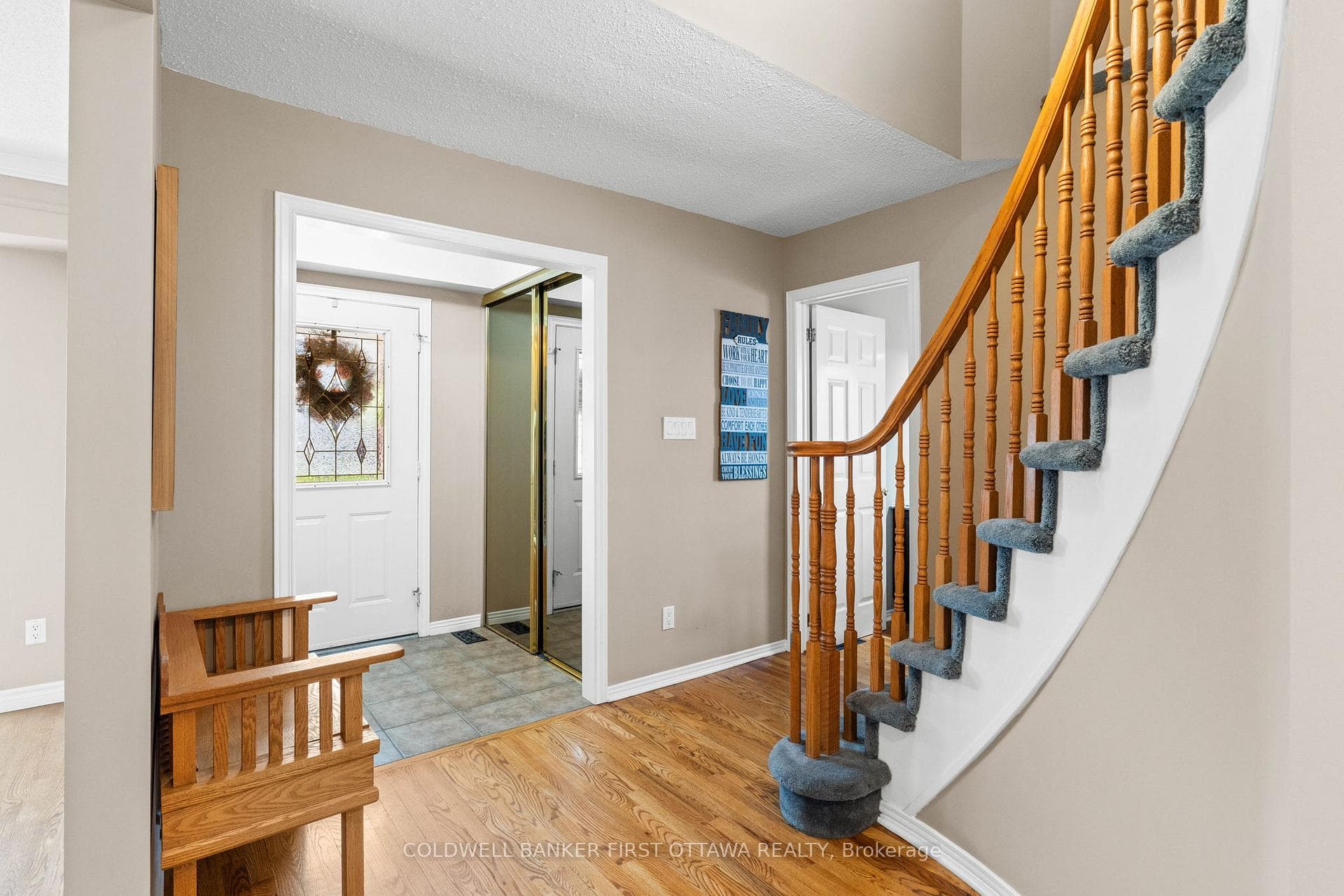 Tiled front entry way w sliding door closet.