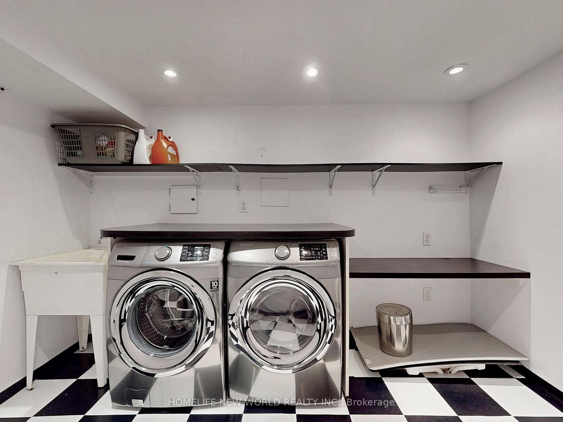 large laundry room with front-load washer/dryer