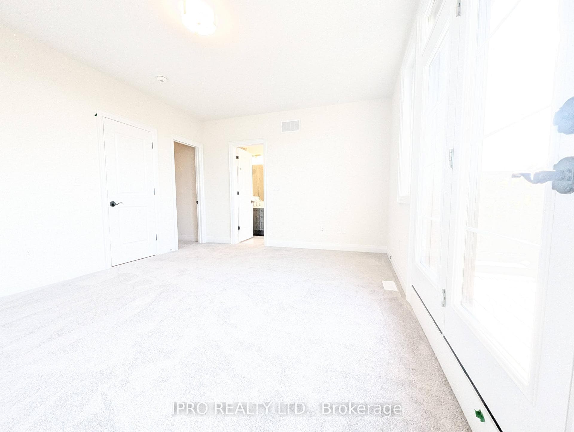 Primary Bedroom with 5-pc Ensuite & Walk-In Closet