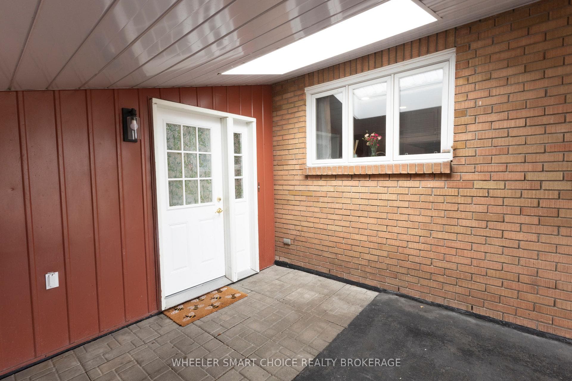 A skylight in the carport brings the sun in.
