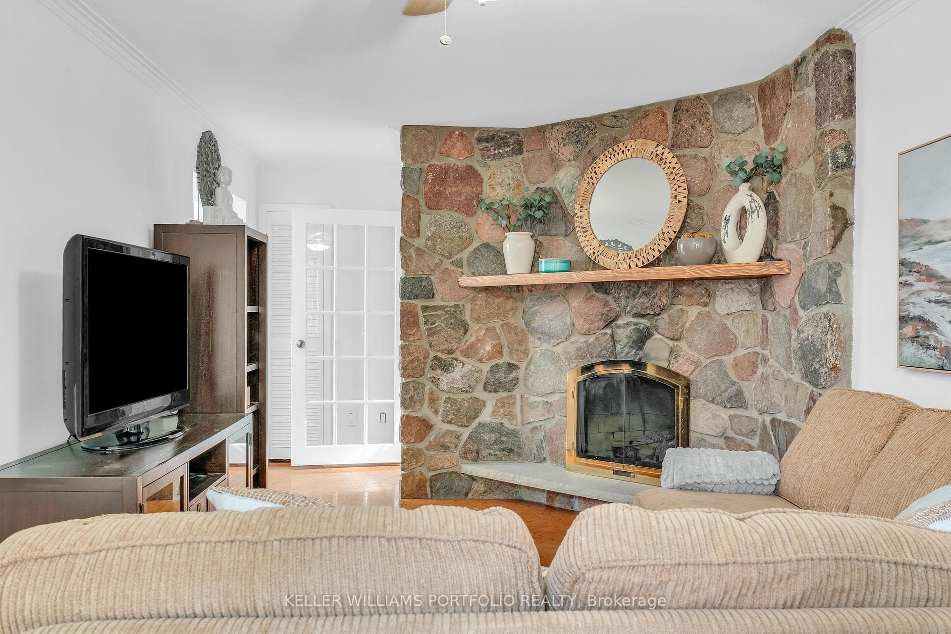 Family room with Stone Gas FP access to Backyard