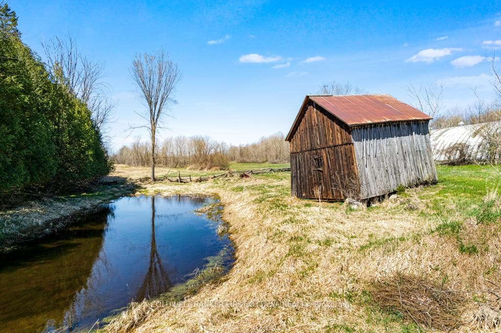 Small quaint barn and pond for winter skating