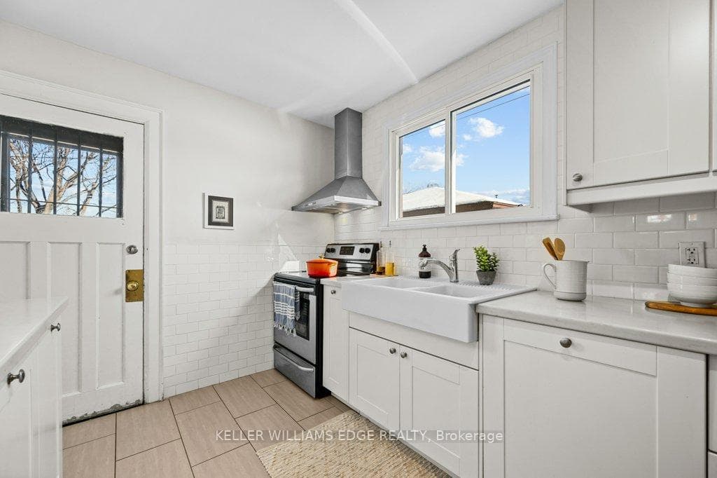 Kitchen with a farm-house dbl sink & w/o to deck