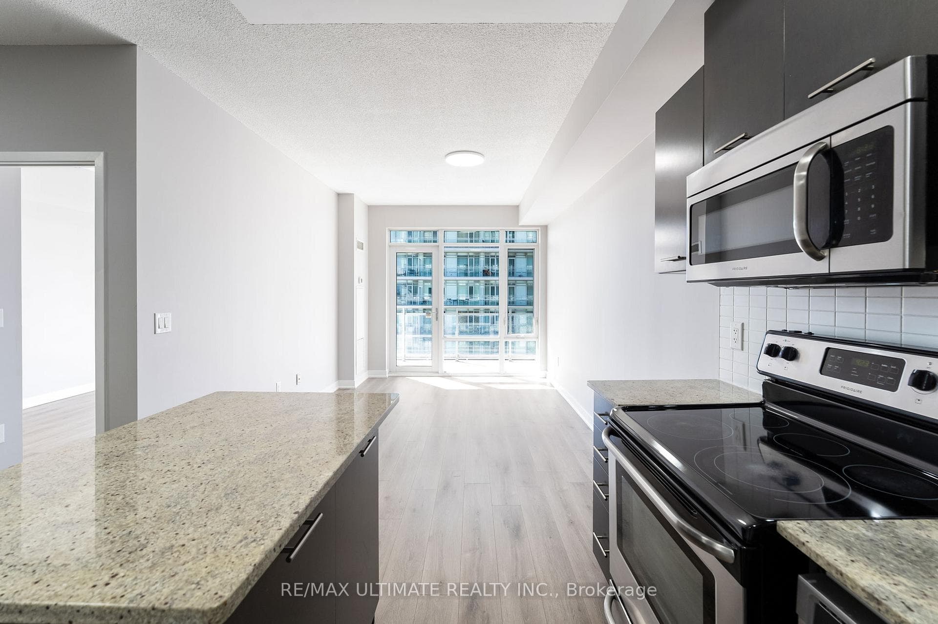 Kitchen Overlooks Living/Dining Areas