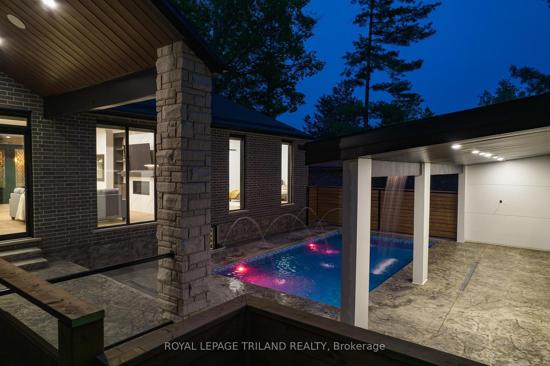 Awesome pool night lighting w/ fountains+waterfall