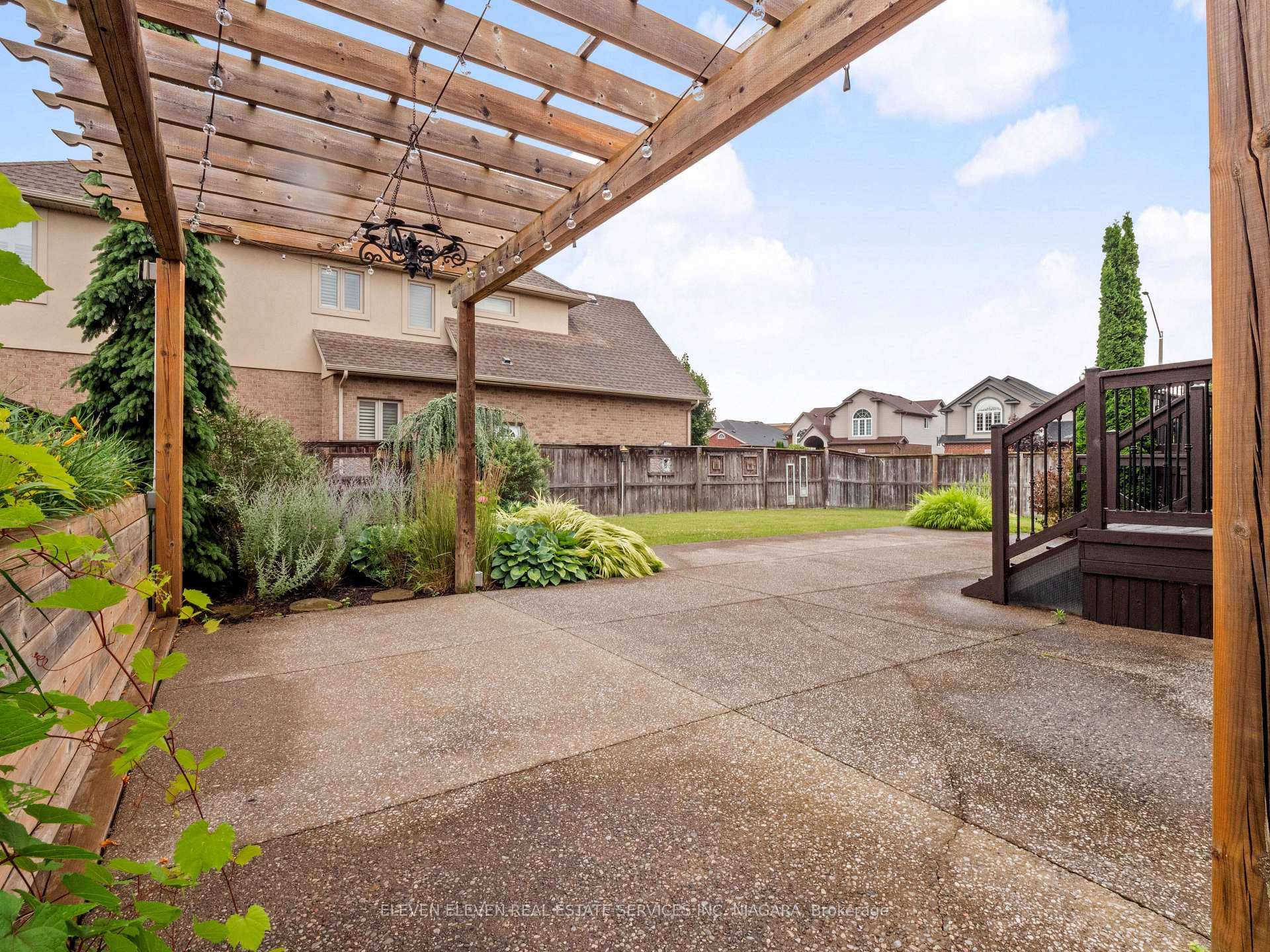 Pergola over Patio surrounded by lush landscaping!
