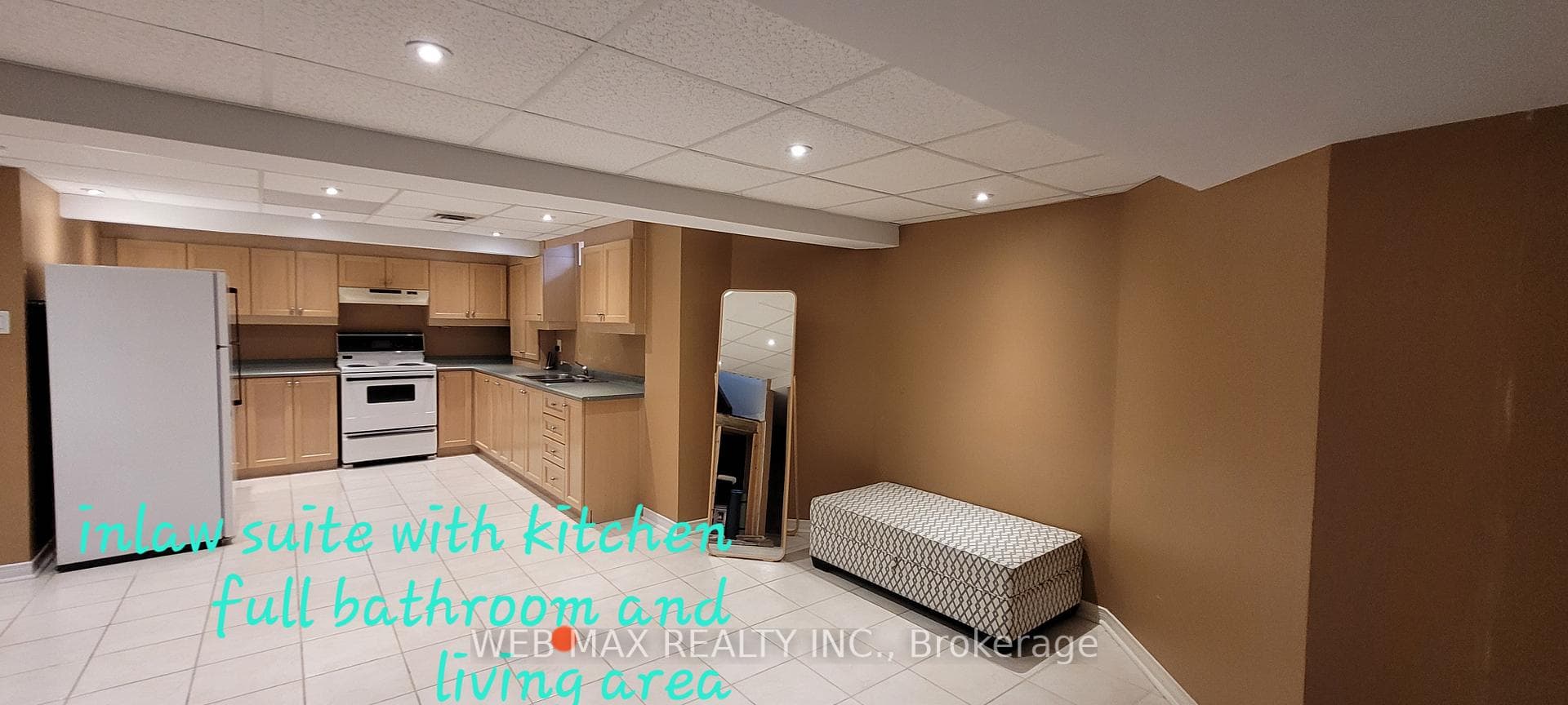 Large kitchen and recreational area in basement
