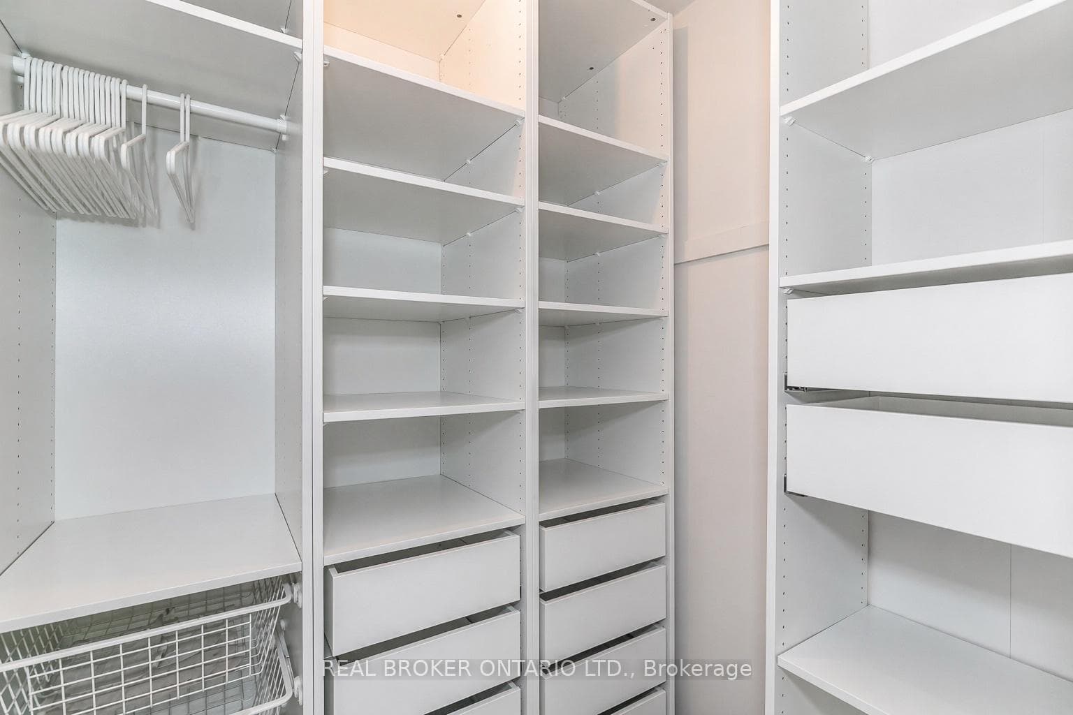 Primary bedroom walk in closet