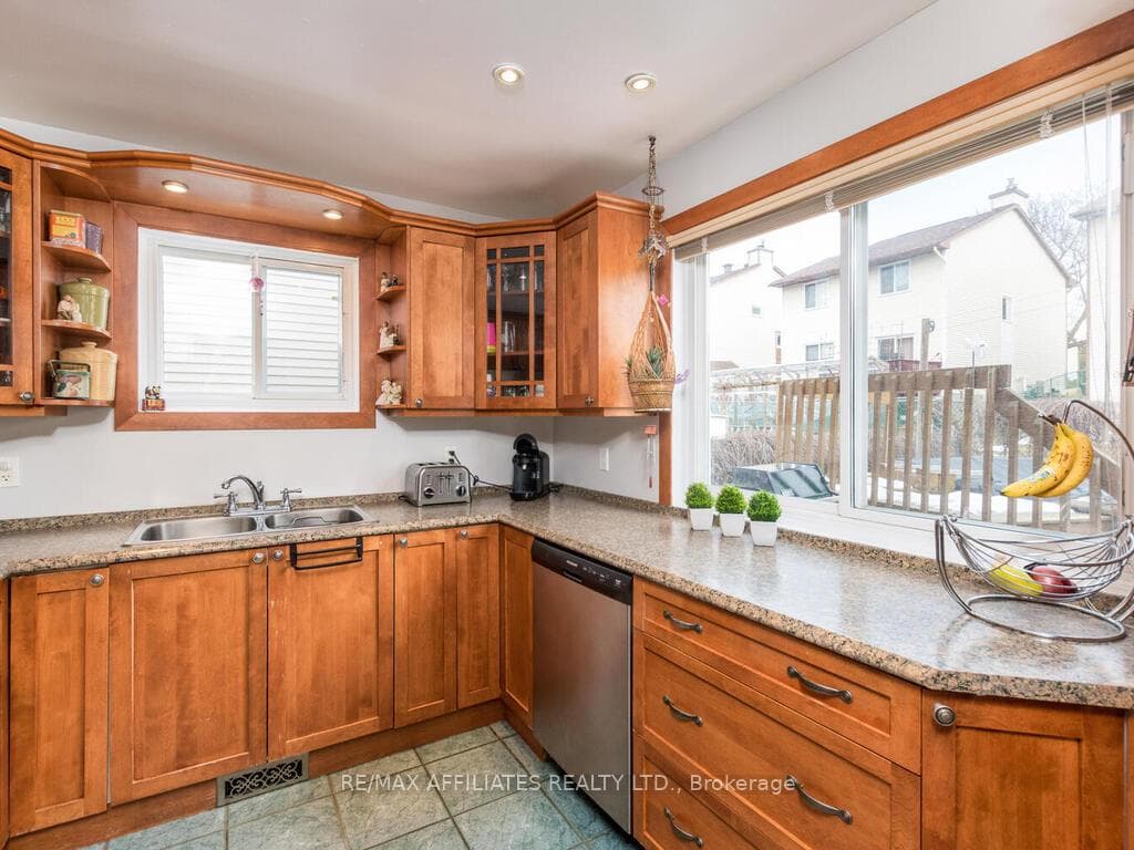 Plenty of Kitchen light with view to outdoor pool
