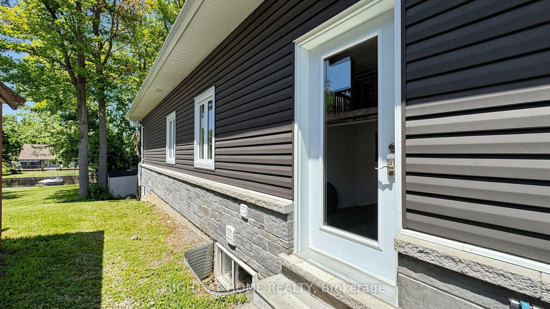SIDE DOOR ENTRANCE TO LAUNDRY ROOM