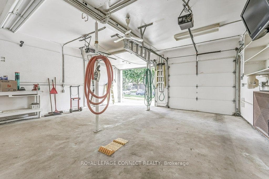 Heated double-car garage w Hot/Cold running water