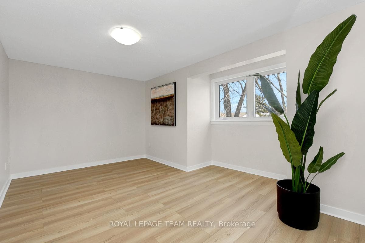 Primary bedroom is large and bright with laminate.