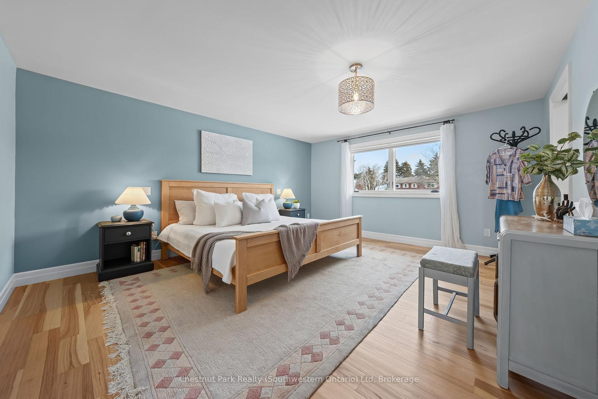 Primary bedroom, hardwood floors, walk-in closet