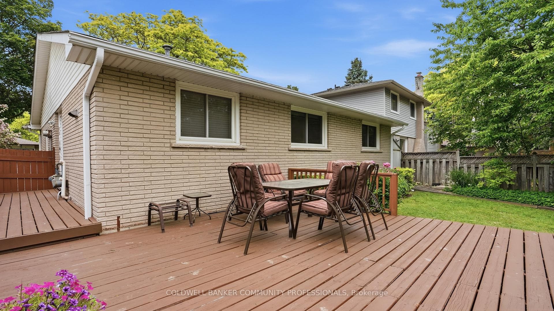 private yard with deck and sheds