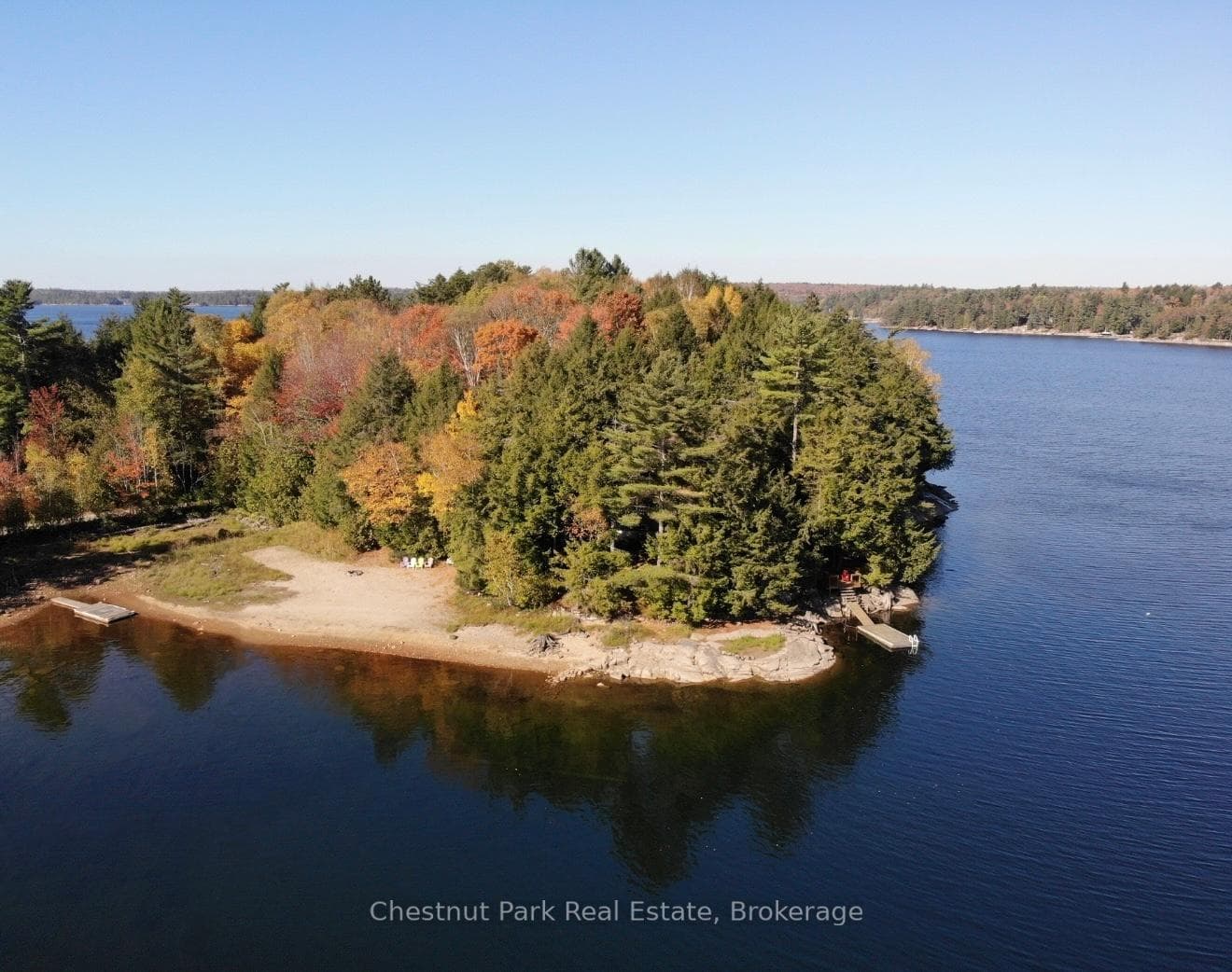 Big lake views + sand beach in sheltered back bay