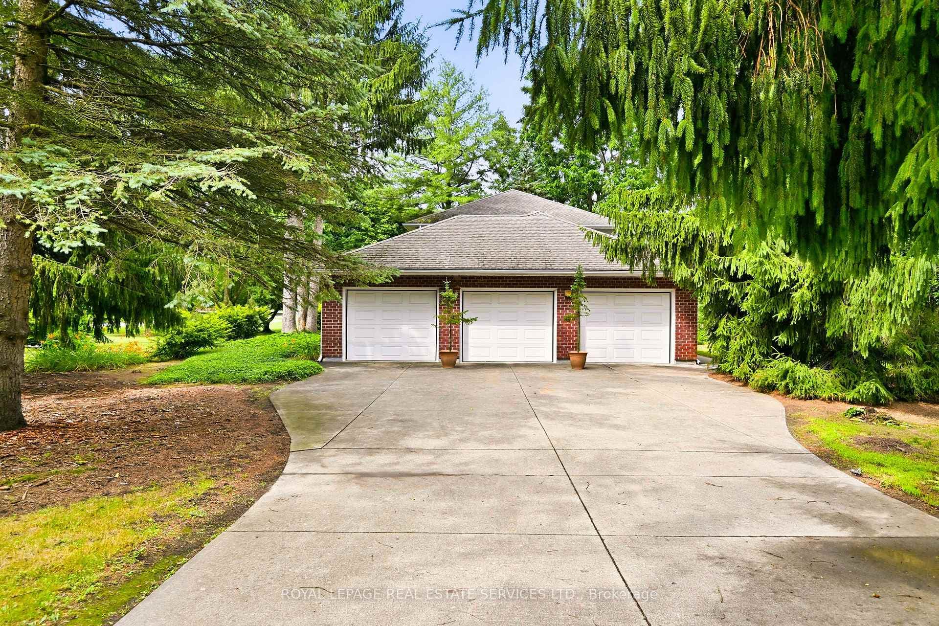 Three Car Garage Accommodates up to Four Vehicles