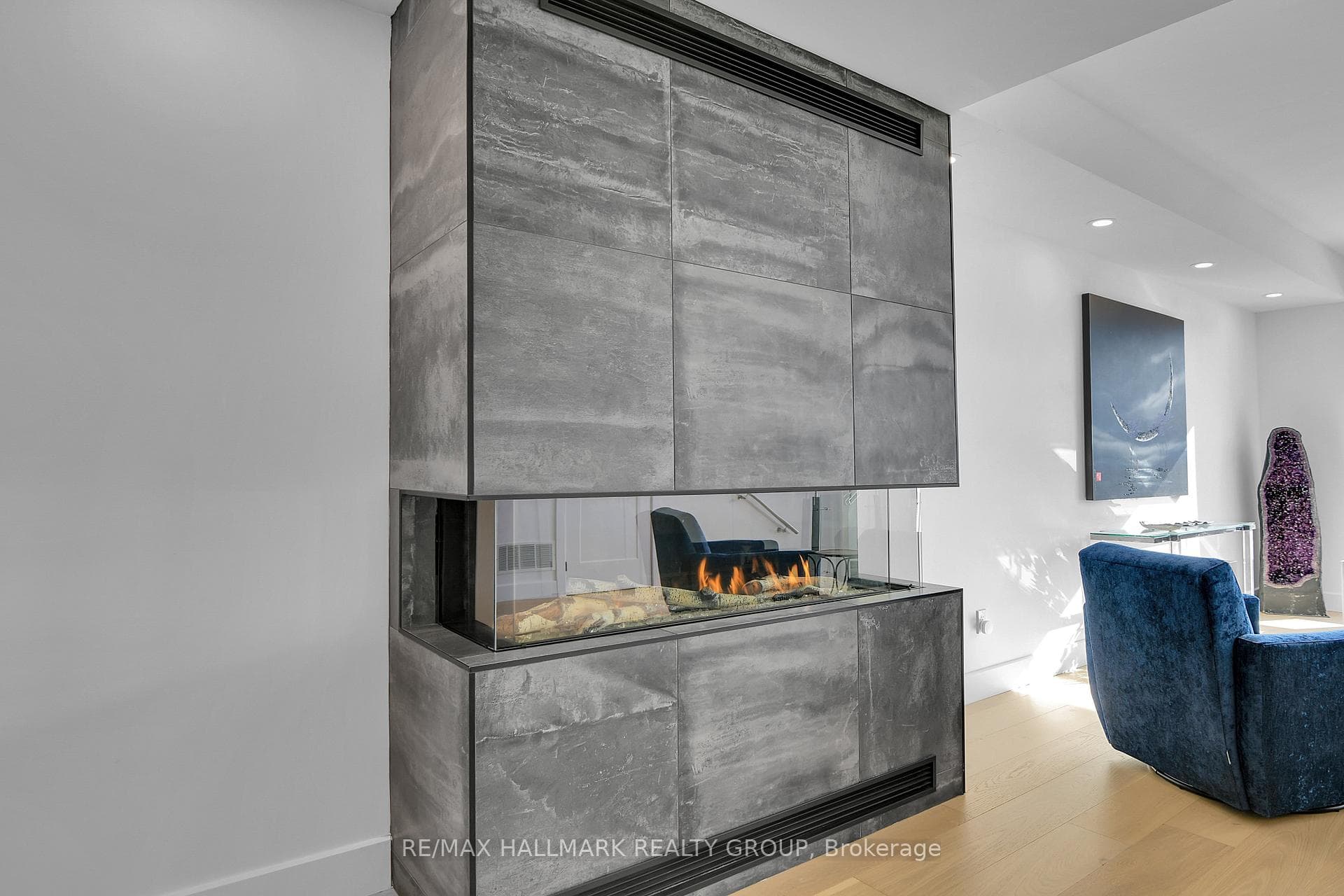 (3-sided gas fireplace with imported tile facade)