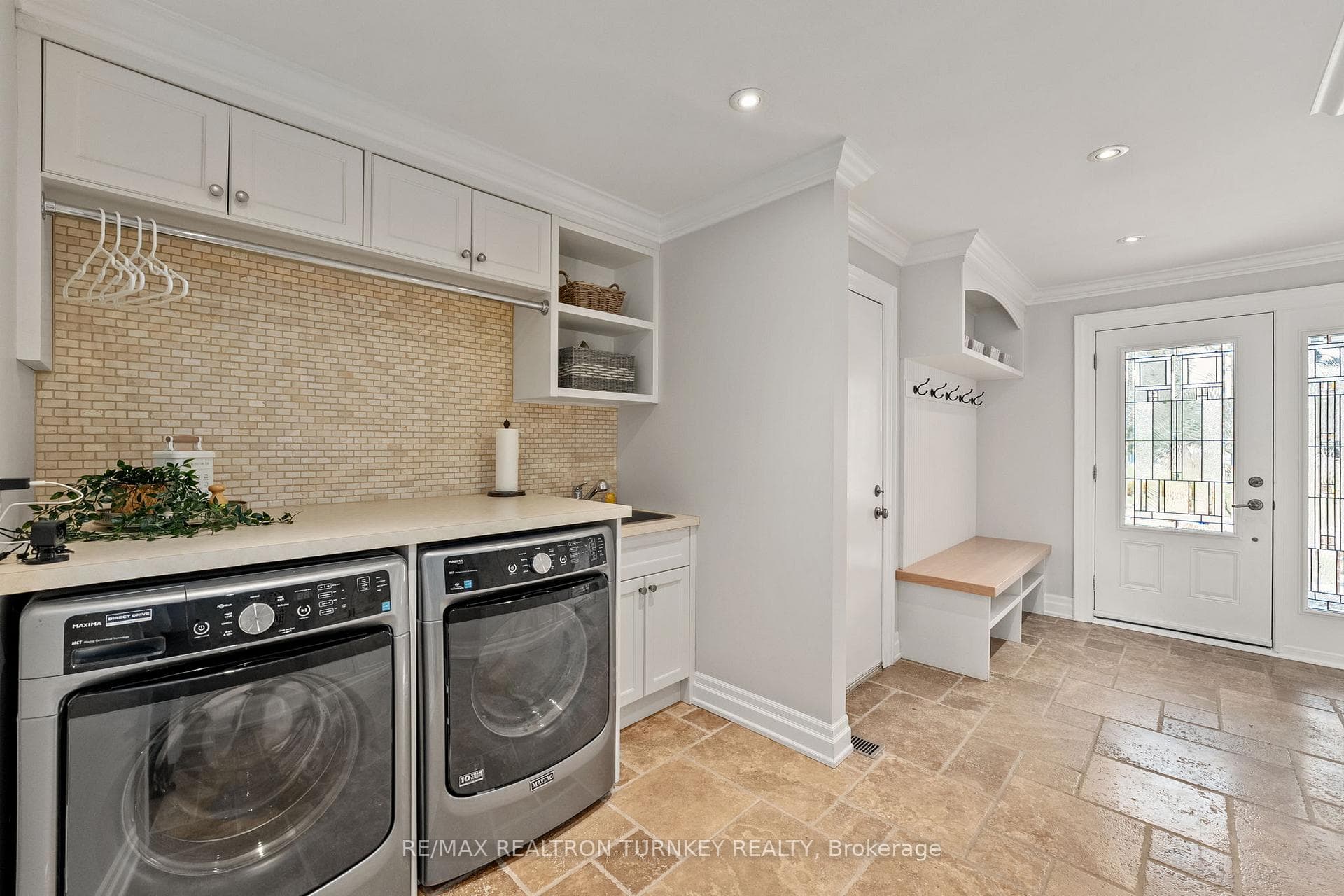 Laundry/mudroom features Travertine Stone floors