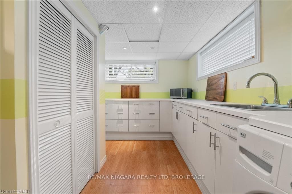 Kitchen with light hardwood / wood-style floors, w