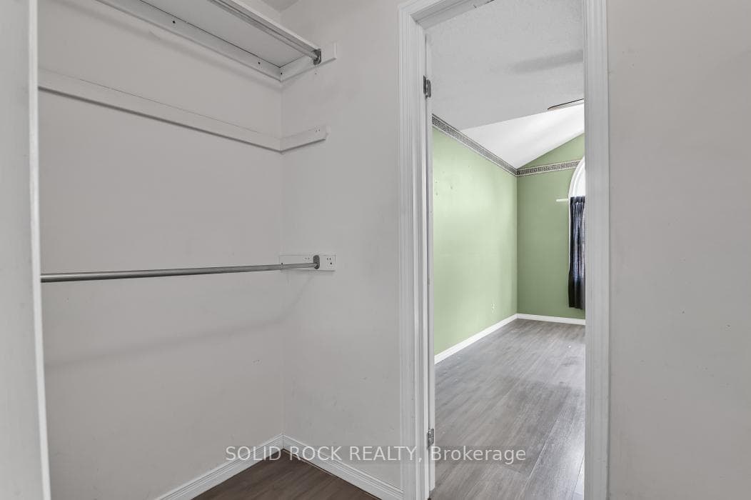 Walk-in closet in primary bedroom