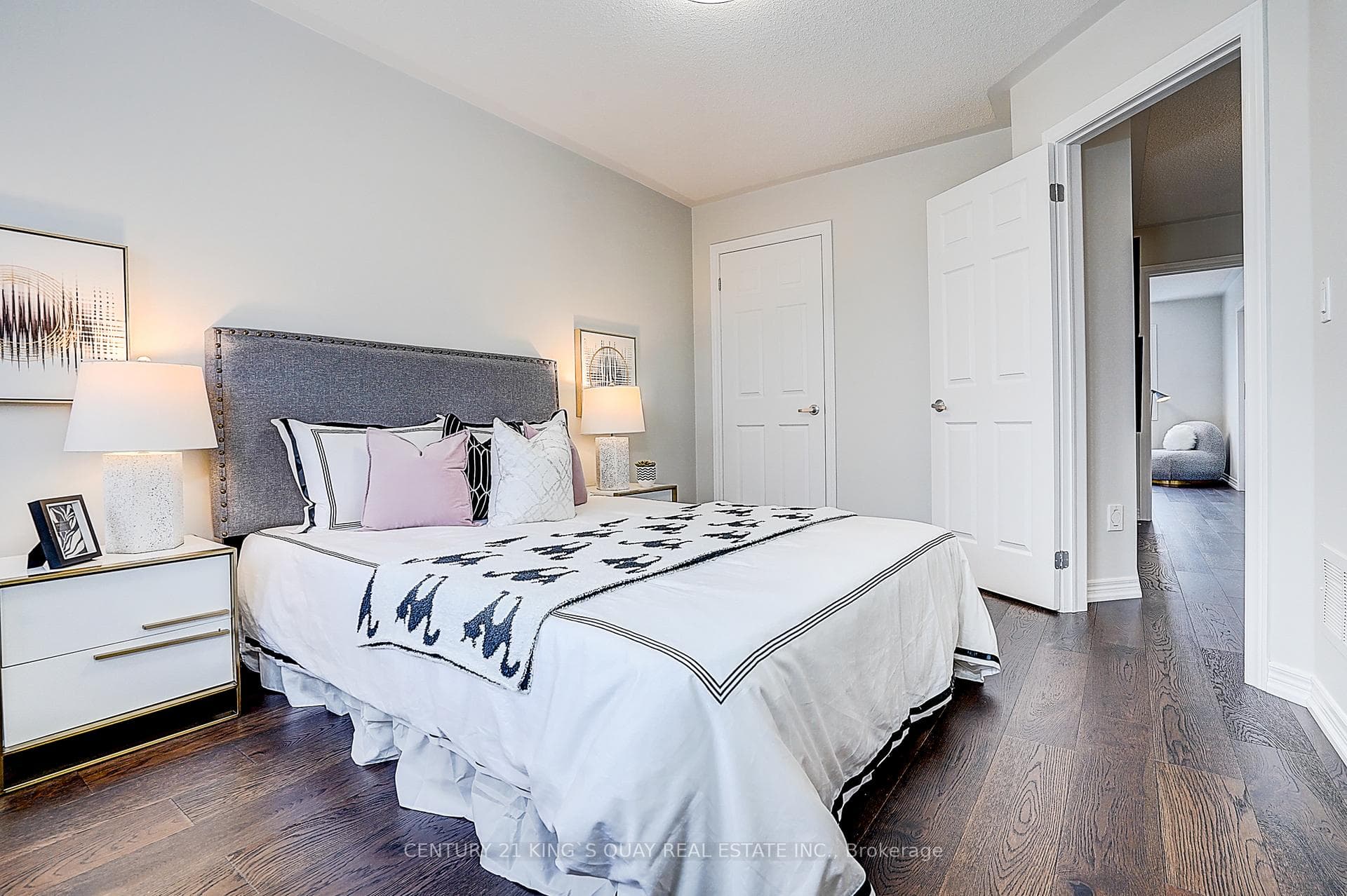 3rd bedroom with wood flooring, windows, closet