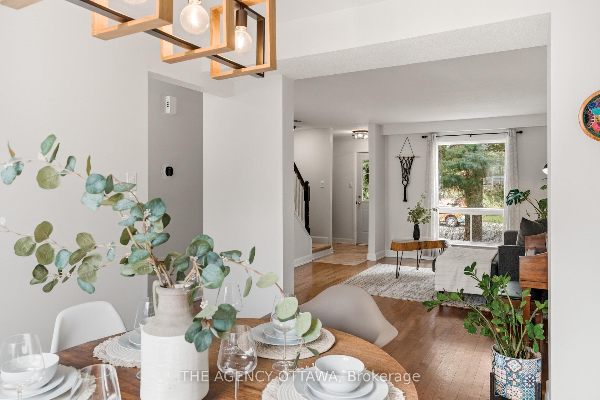 Sun-filled dining area with hardwood floors