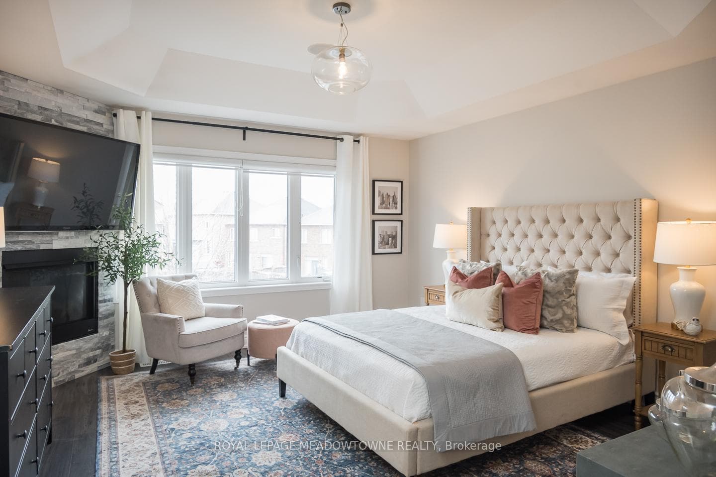 Primary Bedroom w/cozy fireplace & brick surround