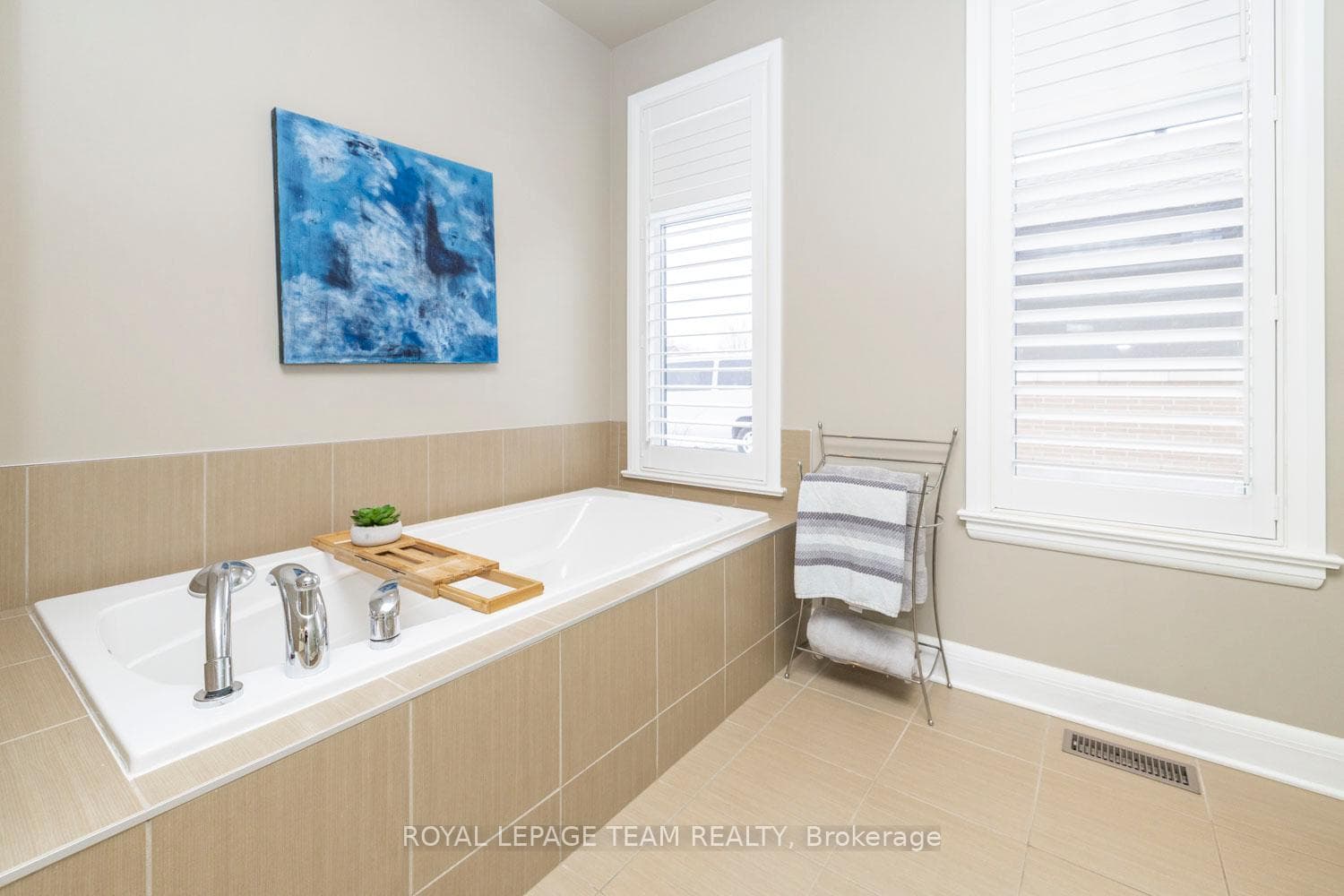 Spa-like bath with deep soaker tub and tile.