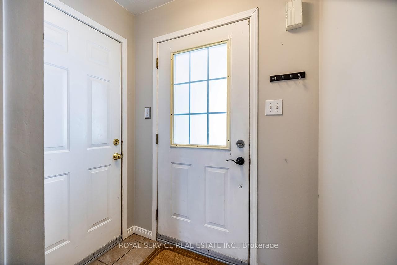 Main entrance with separate door to garage.
