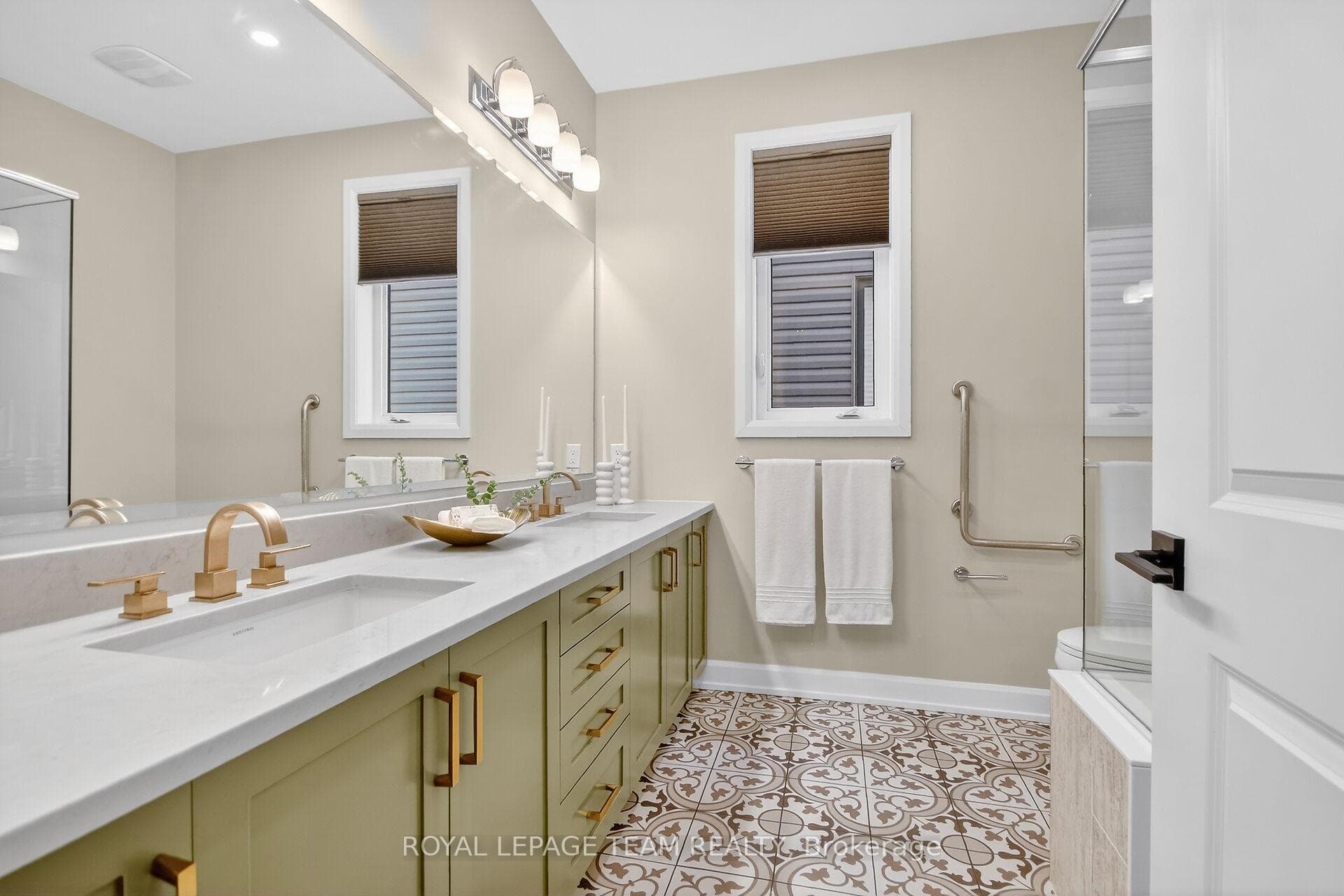 Primary ensuite bath, 2 sinks, heated tile, shower