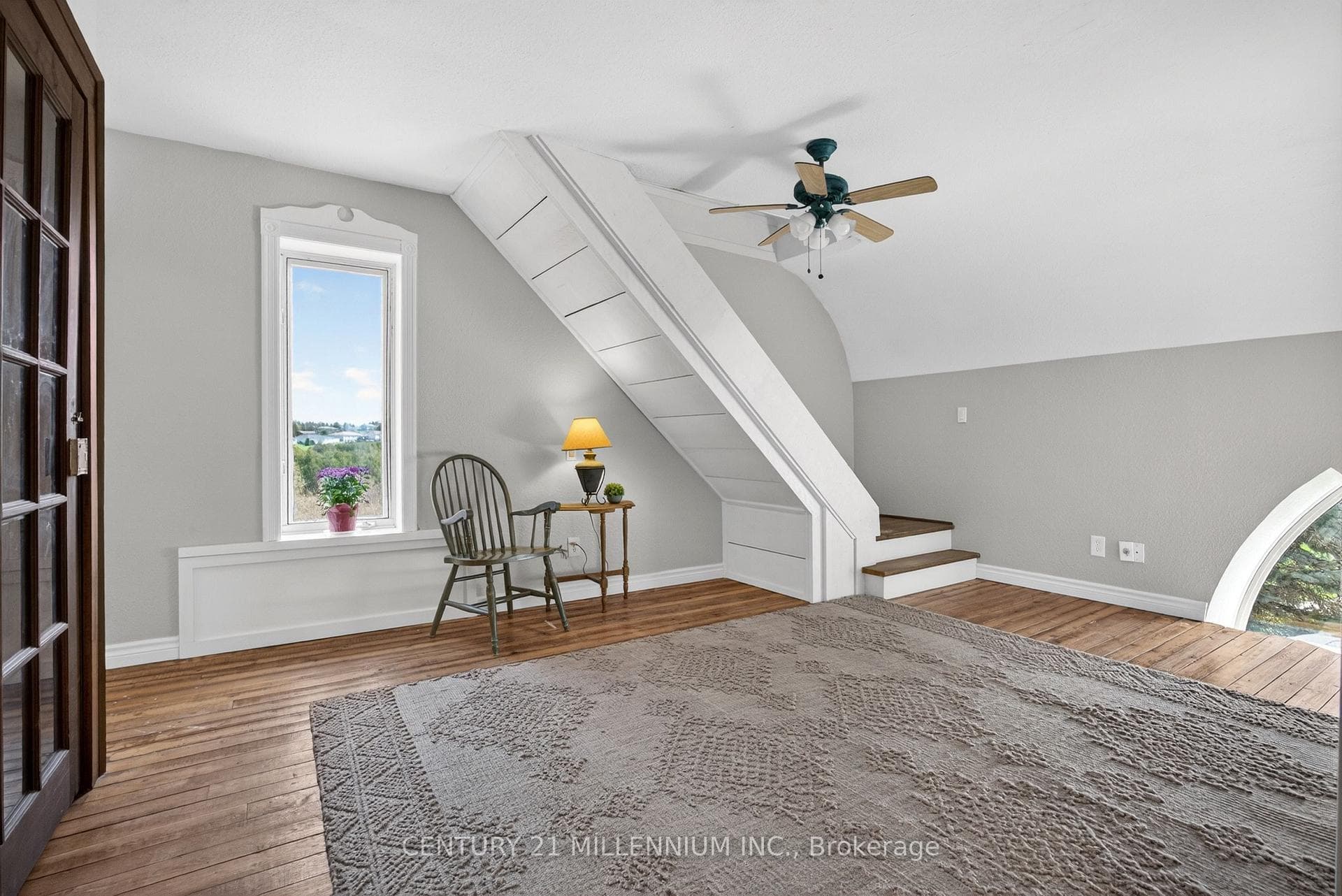 Stairs lead to the 3rd floor primary suite