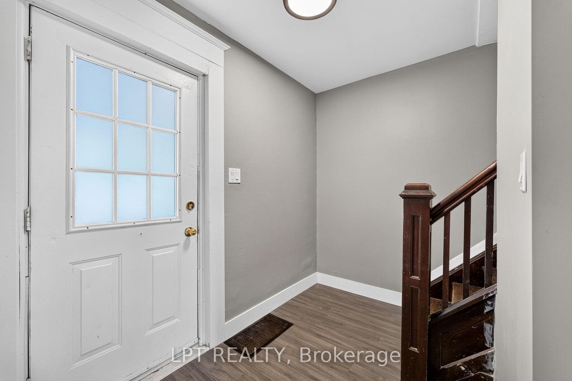 Front door entry to foyer and upstairs.