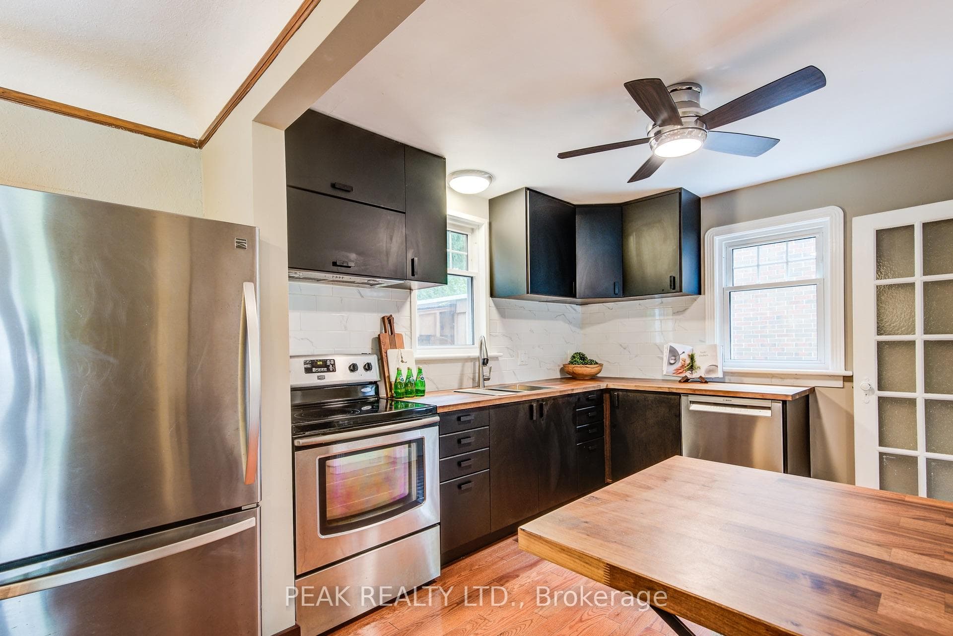 Updated cabinetry, appliances & hardwood flooring