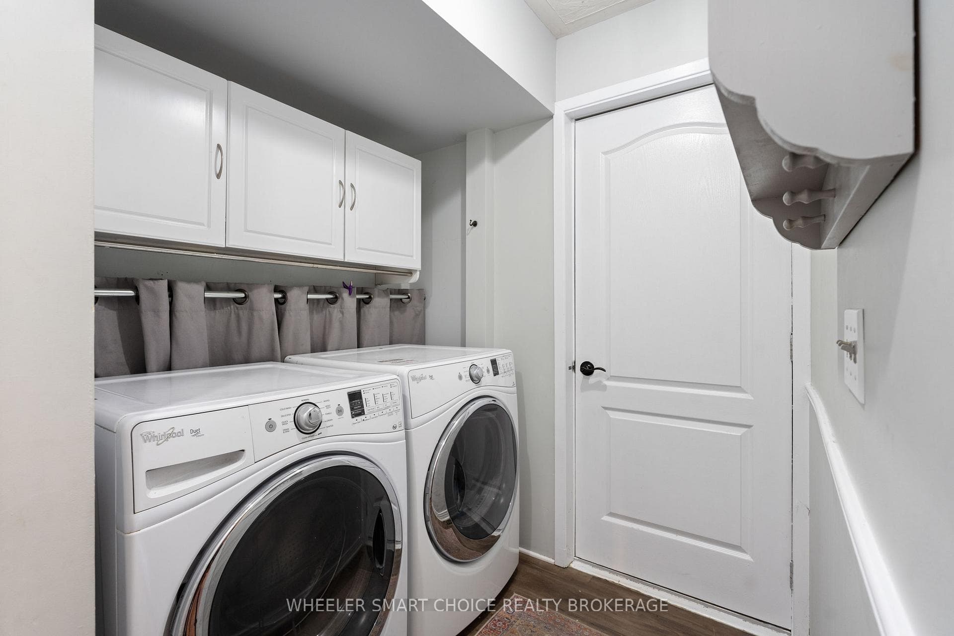 The main floor laundry room with door to garage