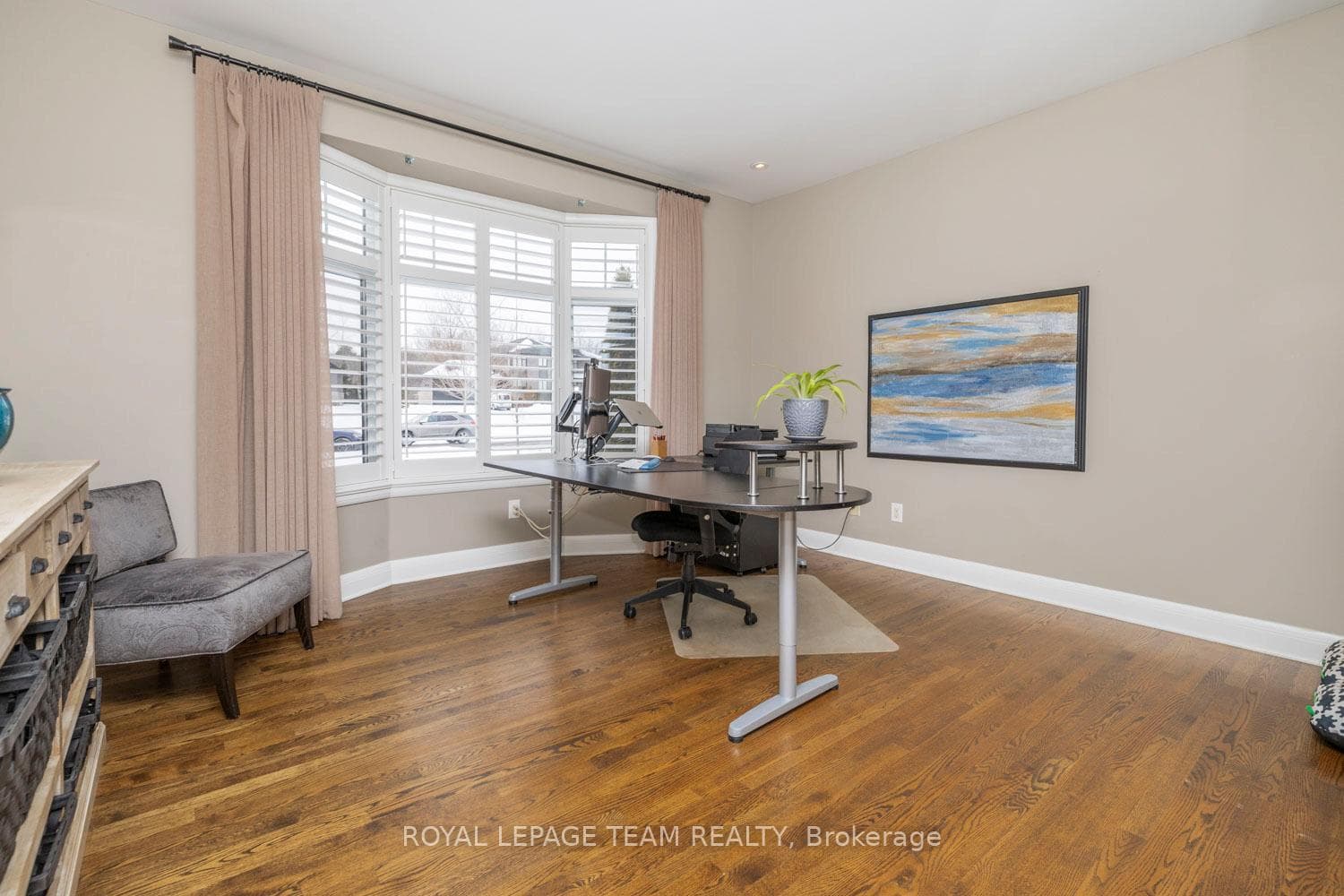 The office has a bay window & potlights.