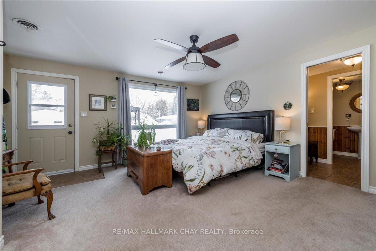 PRIMARY BEDROOM WITH ENSUITE & WALK OUT TO YARD