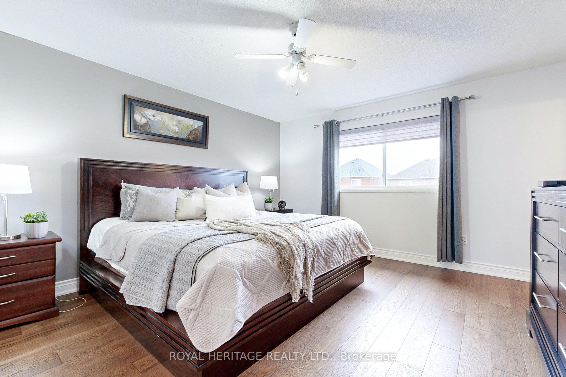 **Primary Bedroom With Hardwood Floors**