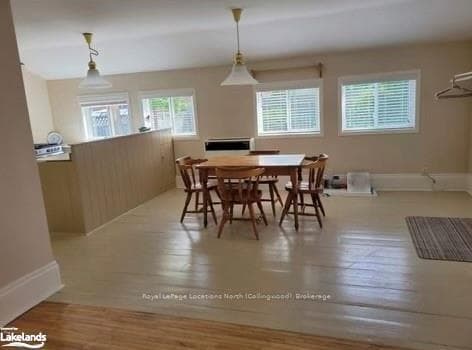 Dining area with light wood-type flooring