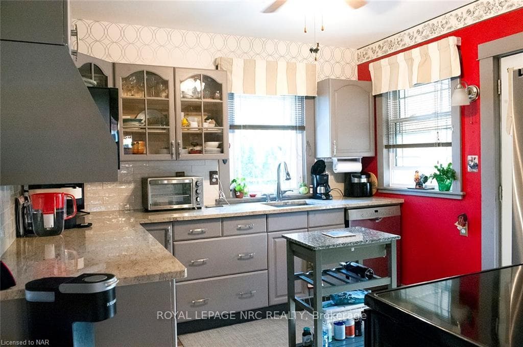 Kitchen with garden door to back porch and deck