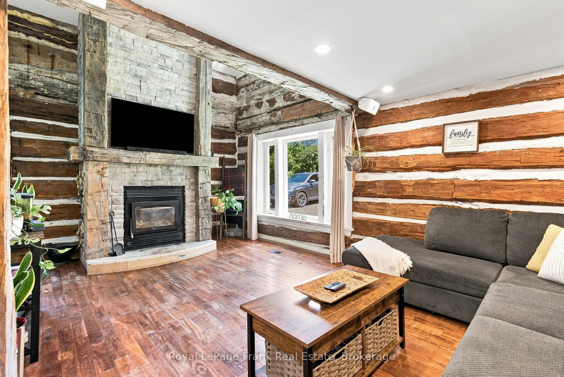 Living room with wood burning fireplace