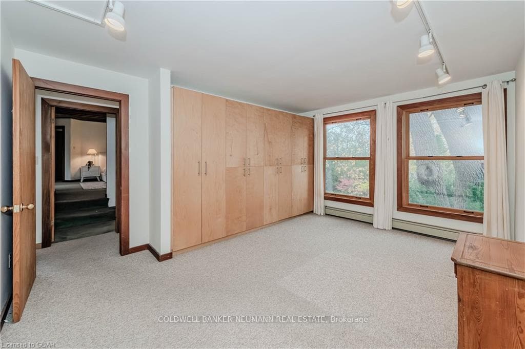 Unfurnished bedroom with carpet