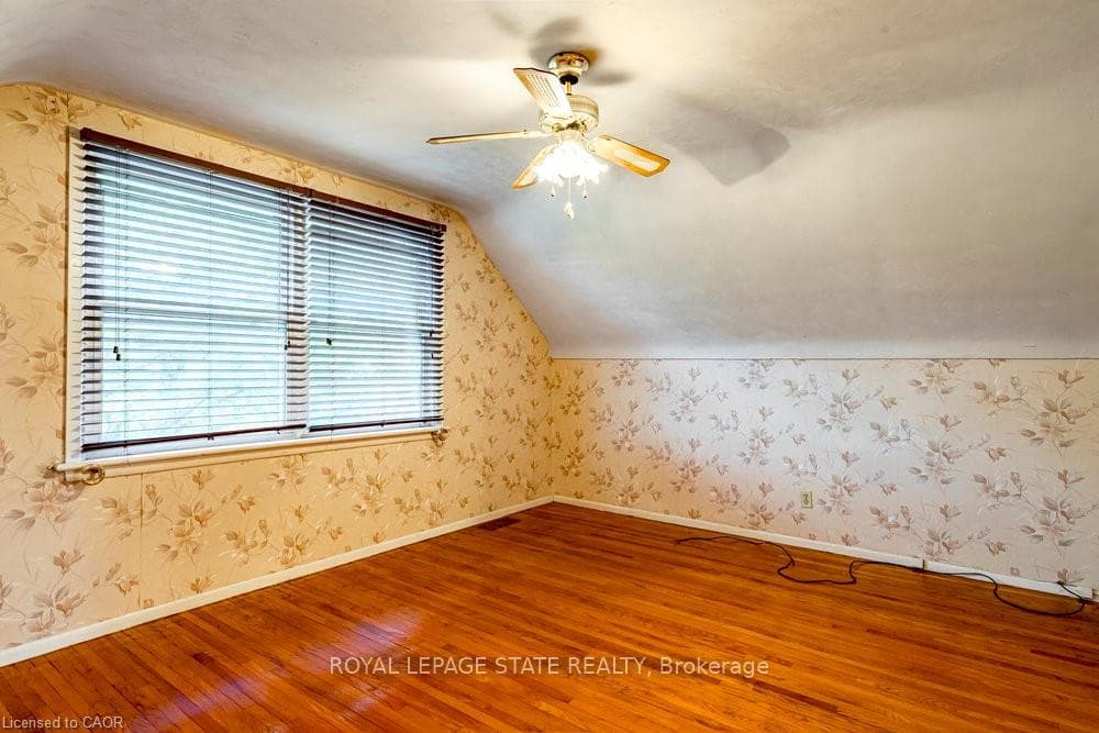 1 of 2 upper level bedrooms w/ hardwood & closet