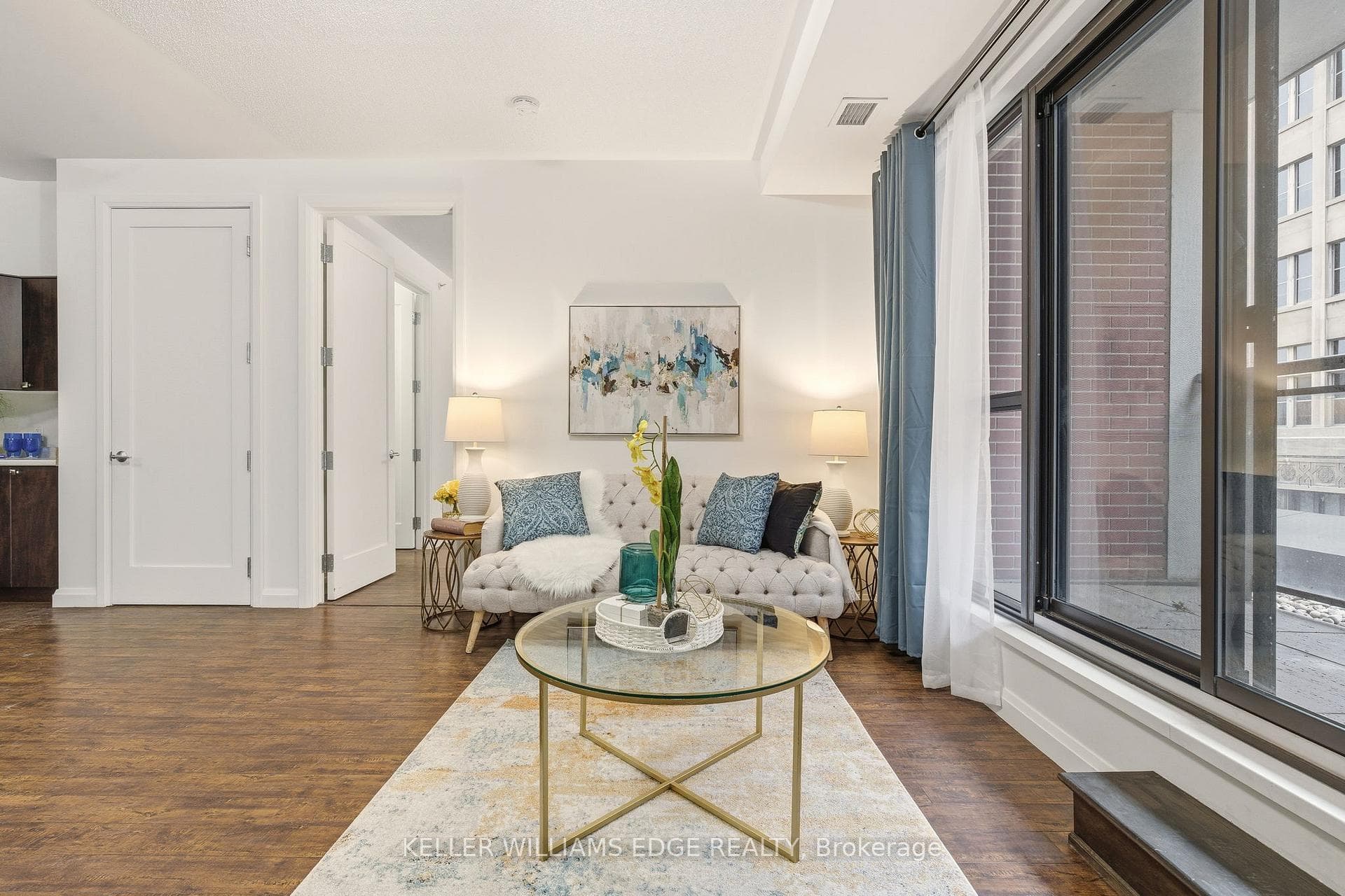 Bright open-concept living area with balcony