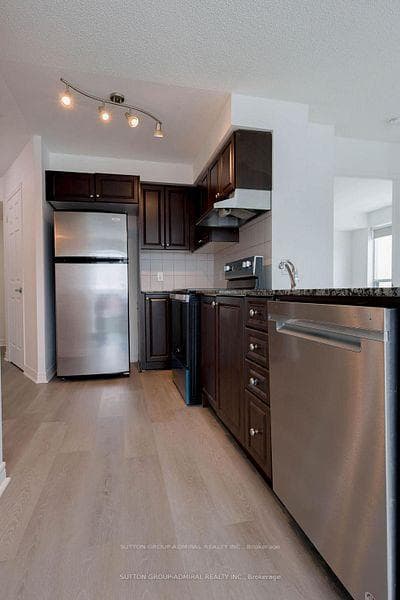 Stainless appliances and flat-top stove
