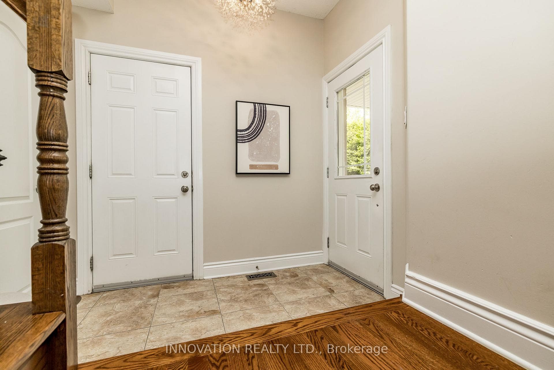 Tiled entry with oversized closet & garage access