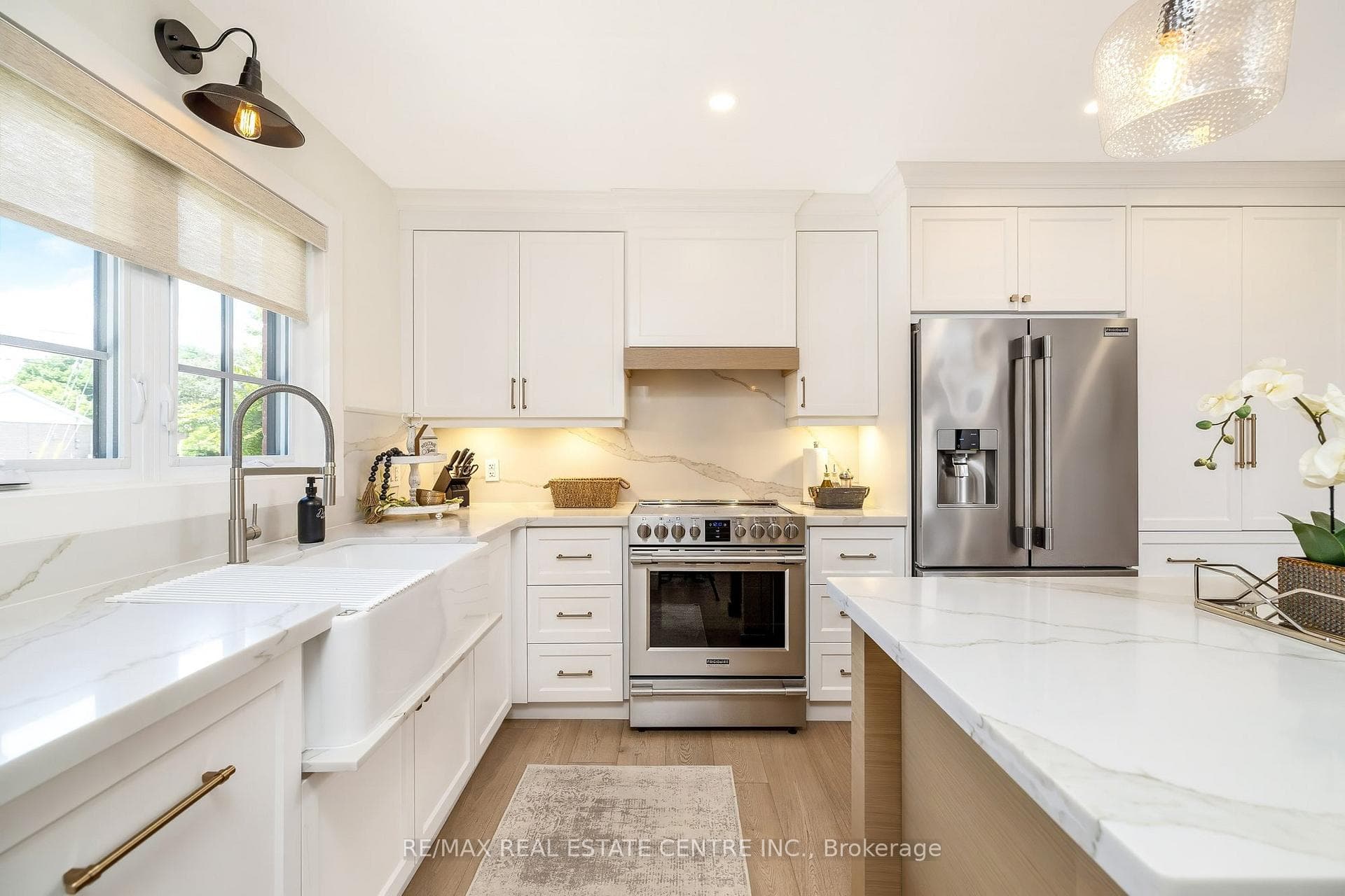 Featuring quartz counters/backsplash