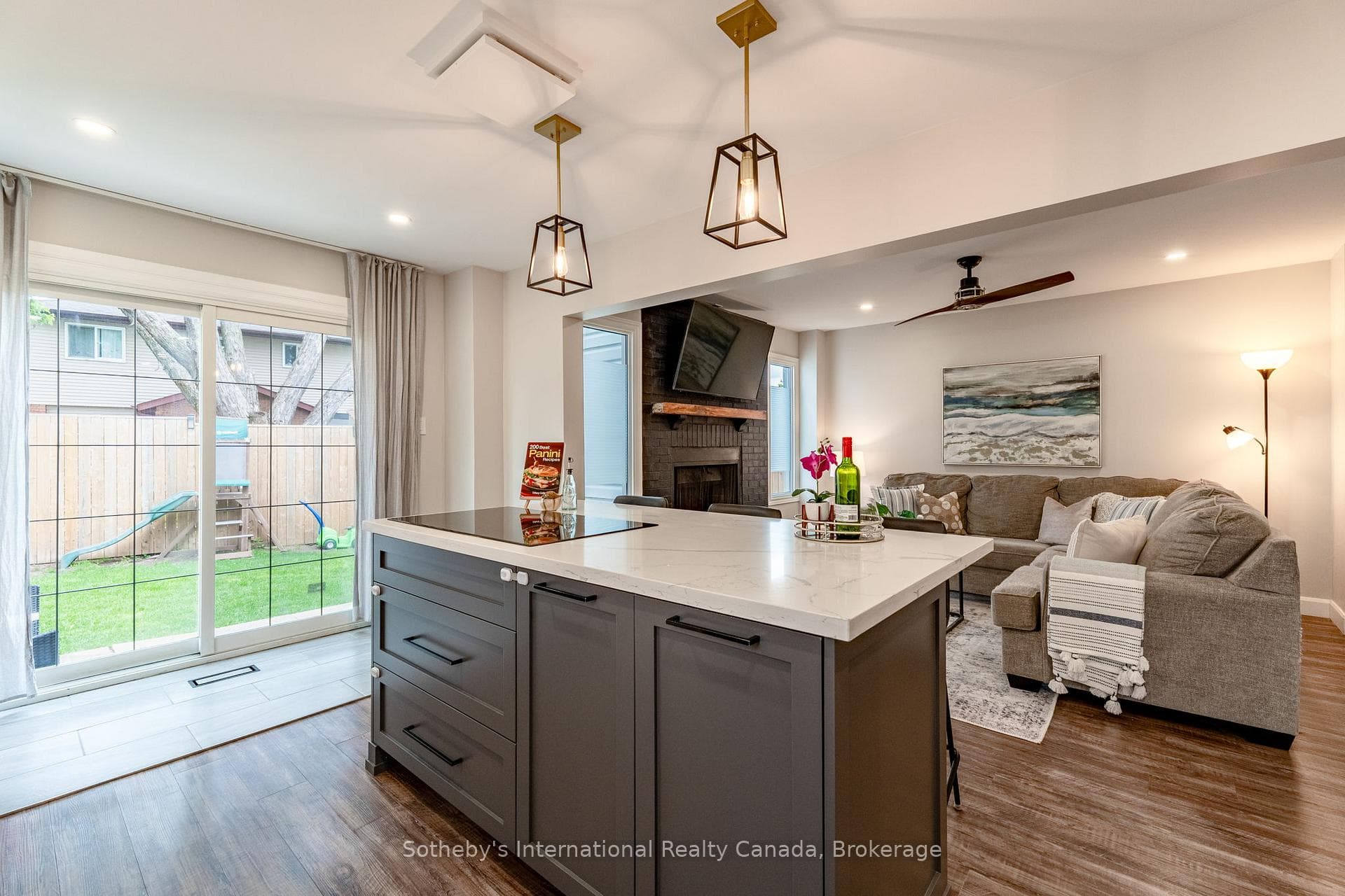 Open kitchen with walk-out to backyard.