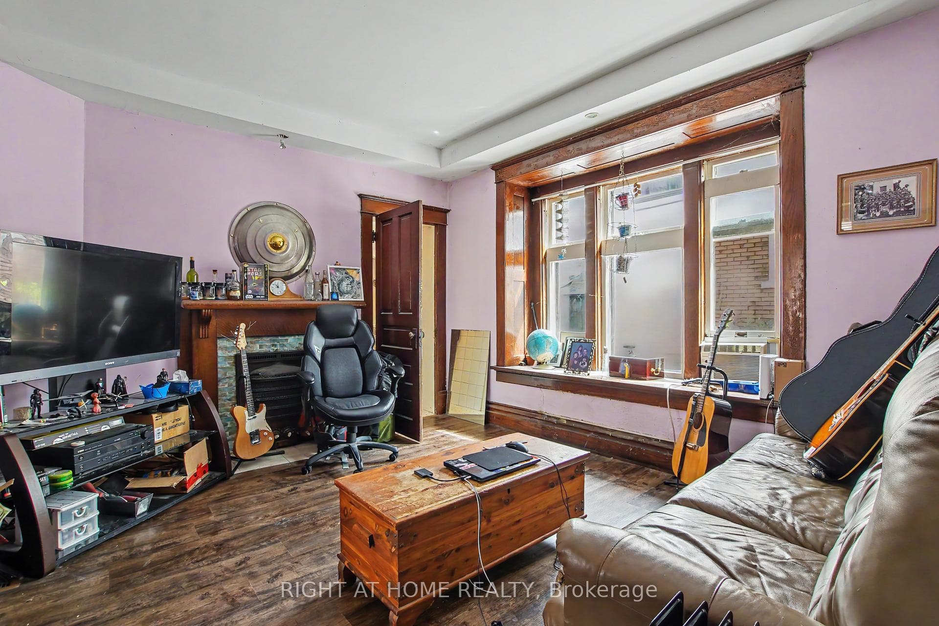 Main Floor, bay window with wood trim, fireplace