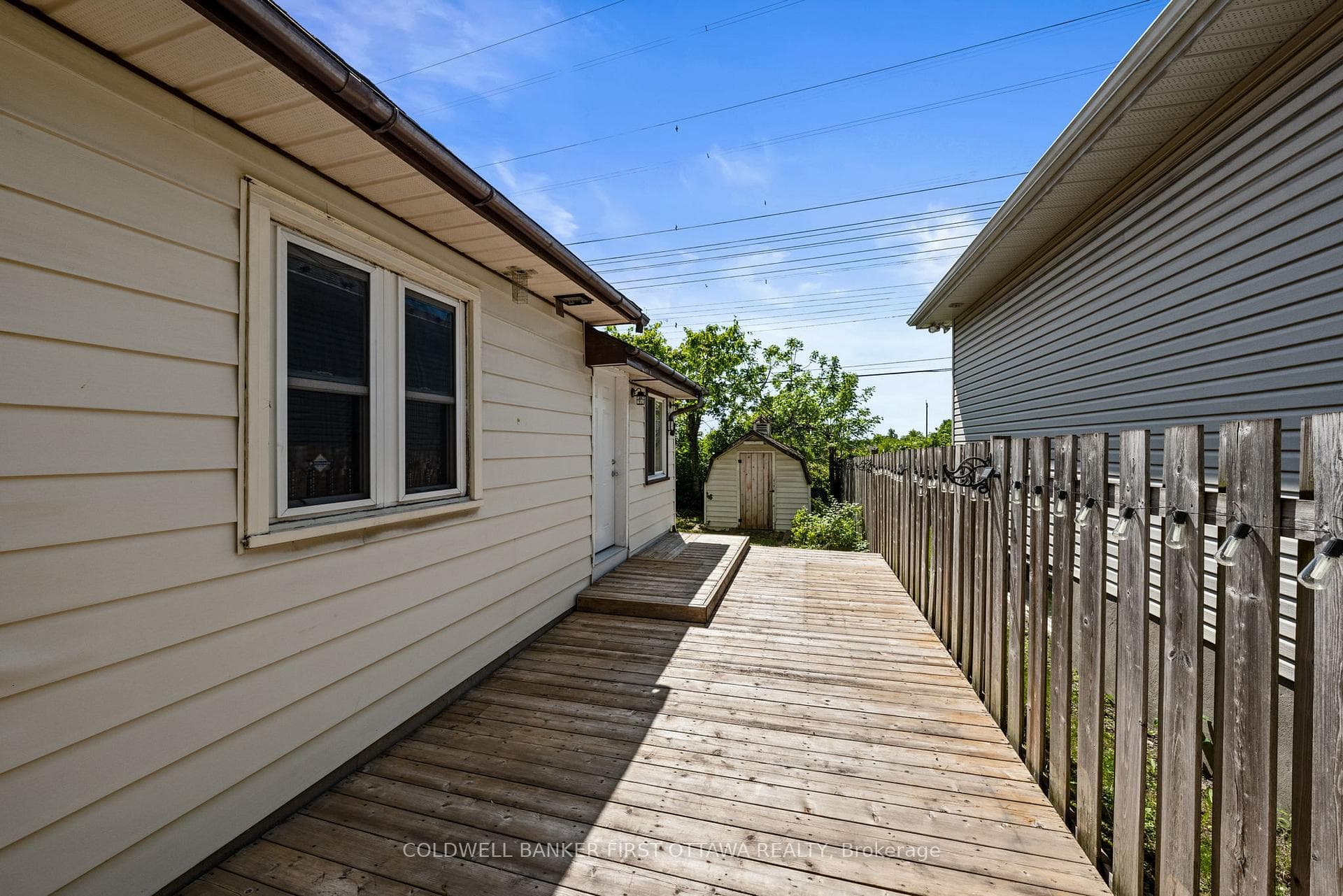 Full deck on right side of home leading to byard.