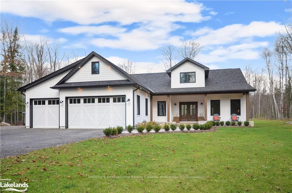 Modern farmhouse with a garage, french doors, and